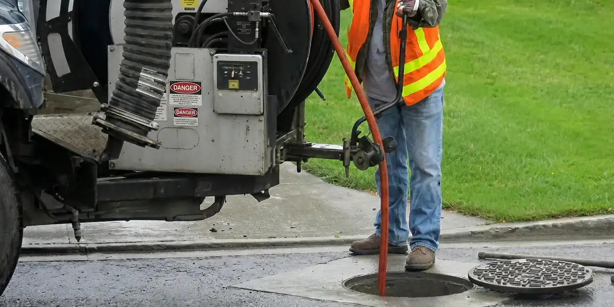 sewage clean up professionals using industrial equipment to remove contaminated wastewater in Colorado Springs, CO