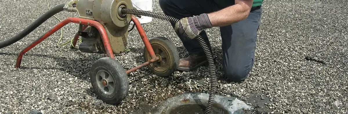 sewer rodding technician actively removing blockages from a sewer line in Colorado Springs, CO